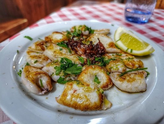 Must-Try Dishes at Bar El Campesino: Ribs & Papas Fritas